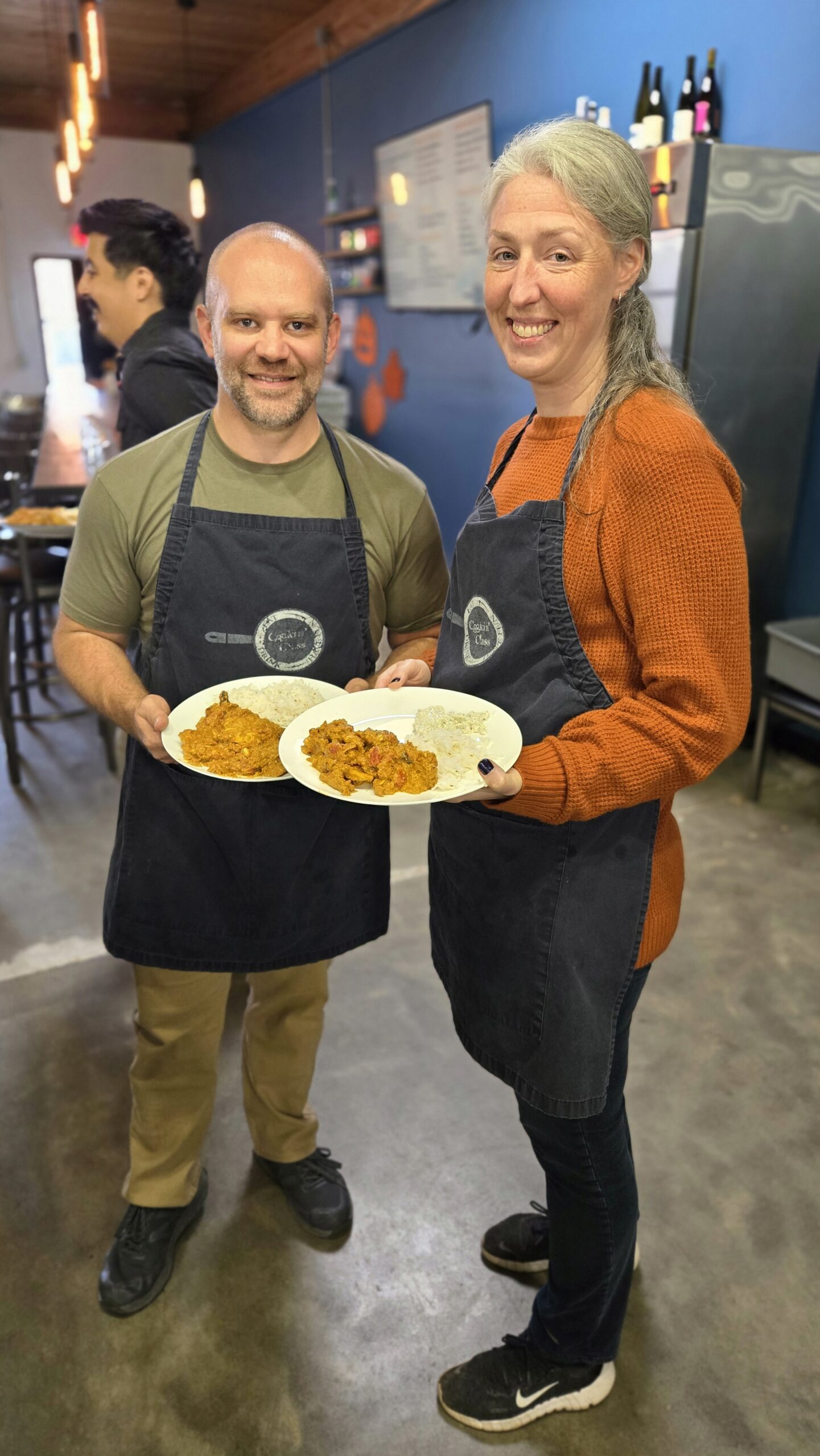 two friends at a cooking class